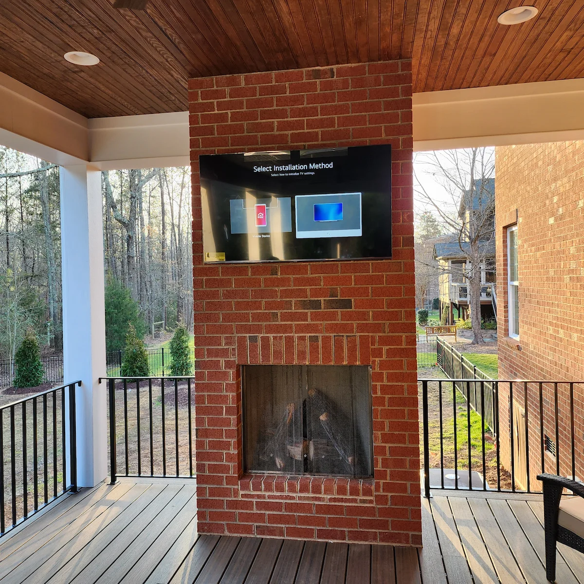 Stone fireplace TV mounting Waxhaw NC Skyecroft estate brick installation