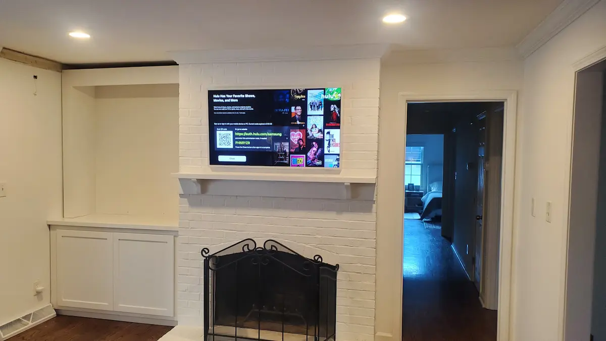 Fireplace TV mounted in Myers Park living room by South Charlotte Services