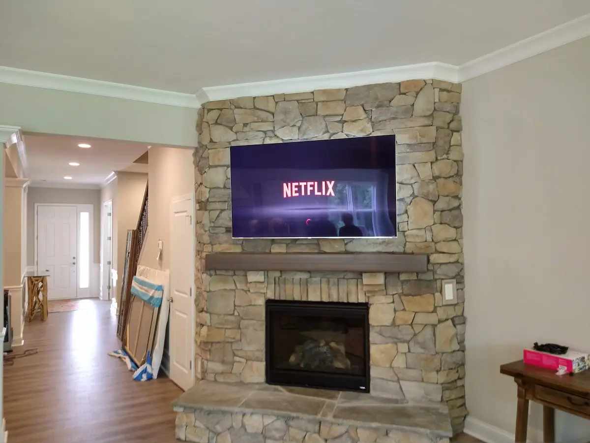 Fireplace TV mounting Indian Trail NC Brandon Oaks stone fireplace installation