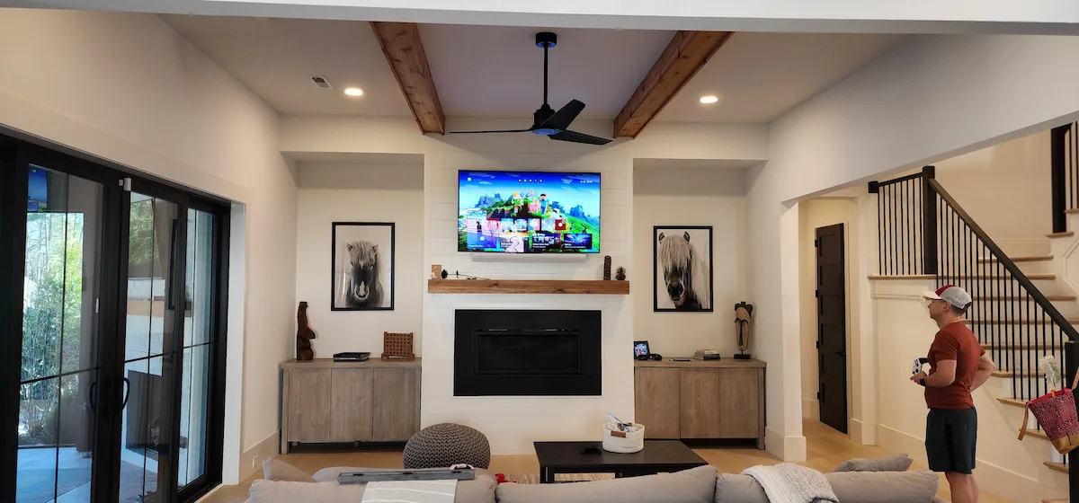 Tv mounting service pineville nc over stone fireplace in mcmullen creek neighborhood with diamond-bit drilling and hilti masonry anchors for secure installation