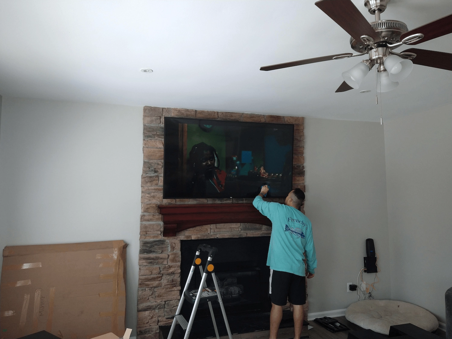 Tv mounted over stone fireplace charlotte nc — south charlotte services retired builder john clay