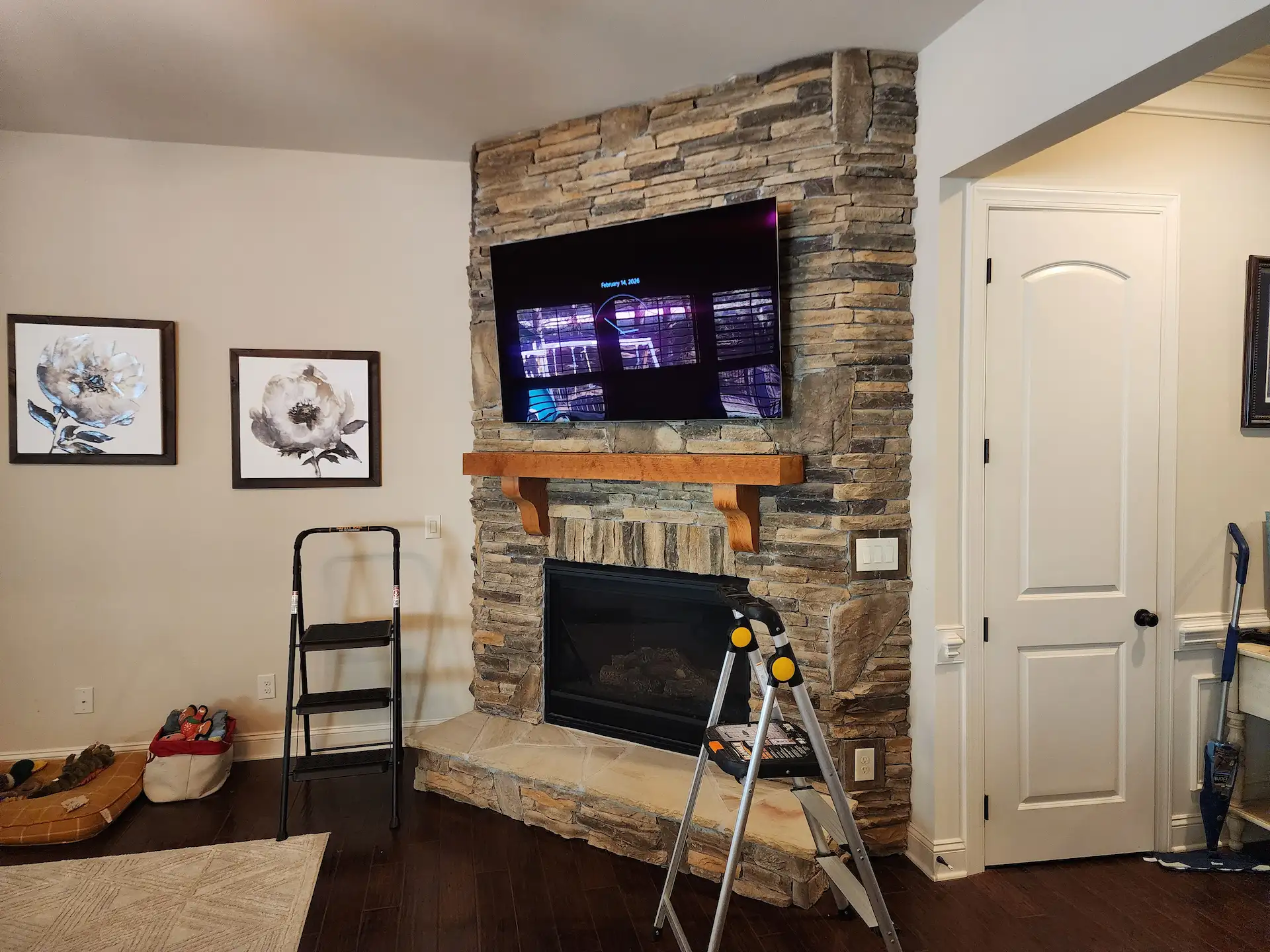 Large flat-screen tv mounted in a wesley chapel nc home with soundbar by south charlotte services