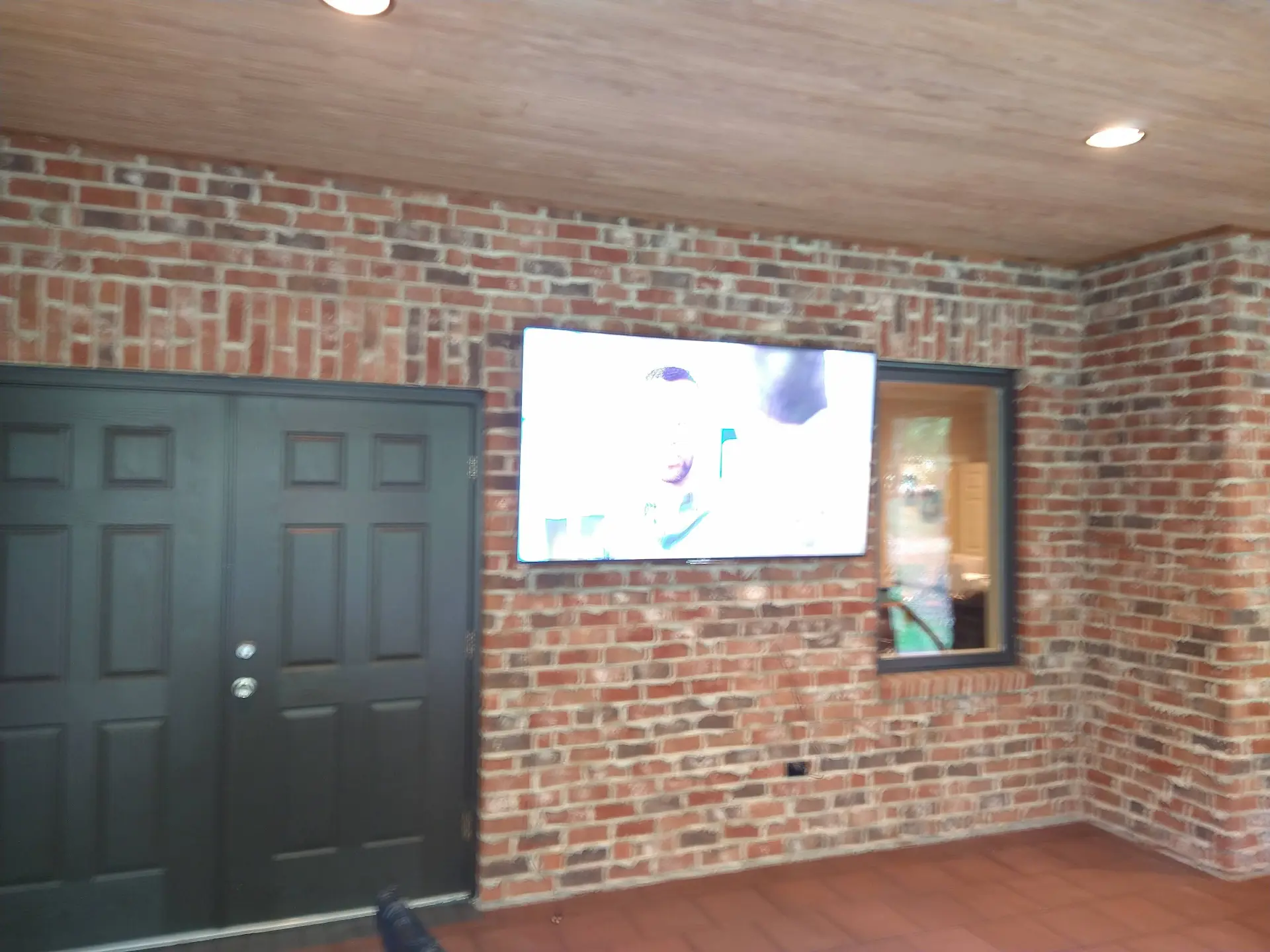 TV mounting on a brick wall in Cotswold Charlotte NC